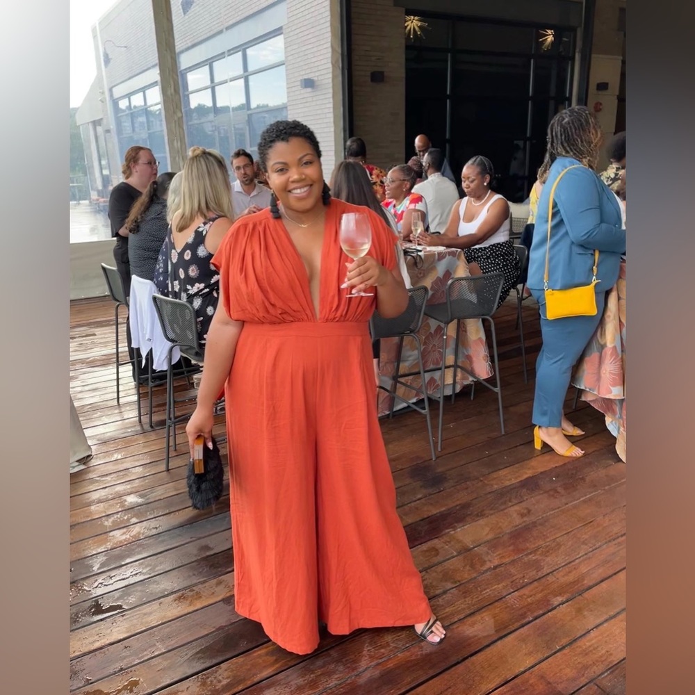 Fashion to Figure orange jumpsuit with deep front opening